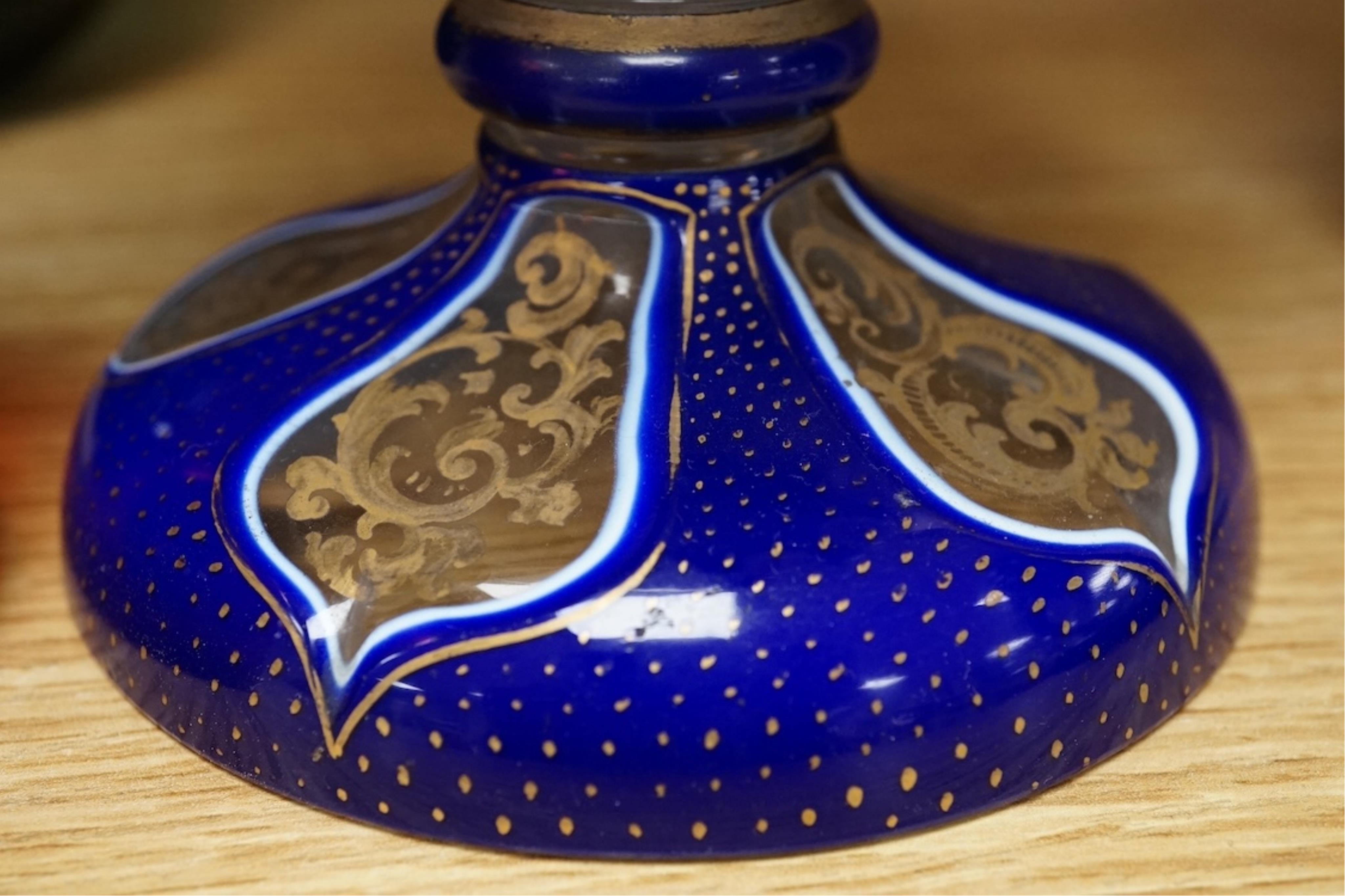 A pair of 19th century green glass fingerbowls, a Bohemian blue overlaid glass vase and a ruby glass scent bottle, largest 20cm high